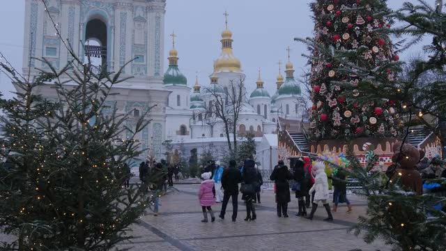 People Families at Decorated Sophia Square Christmas Decorated Fir Animator in Bear Costume Bell Tow