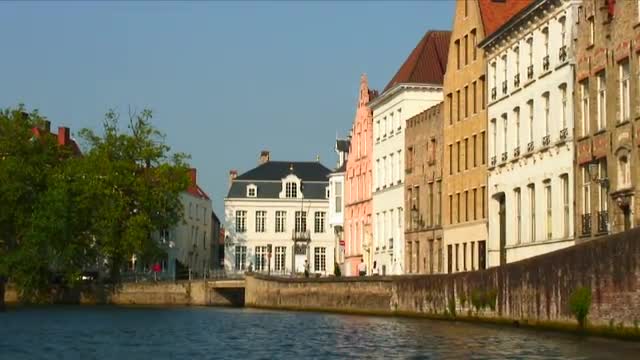 Moving under a bridge on a canal in Brugge, Belgium.