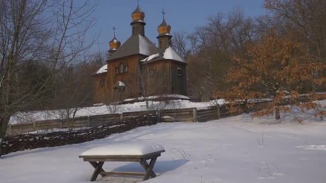Old Wooden Church Table Covered With Snow Rustic House Winter Dry Leaves on an Oak Tree Wattle Fence