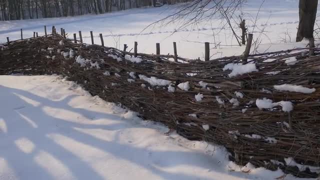 Wattle Fence Around a Houses Village Winter Snow on Roofs Pirogovo Village Near the Church of the Ho