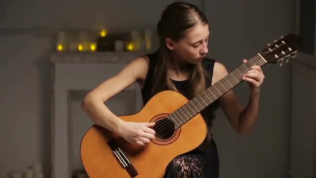 Girl playing the guitar