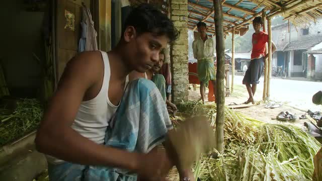 Close up view of mallet hitting die