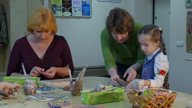 Woman Helps the Child Teachers With Kids Working With Clay Painting Sitting at the Table Brushes and