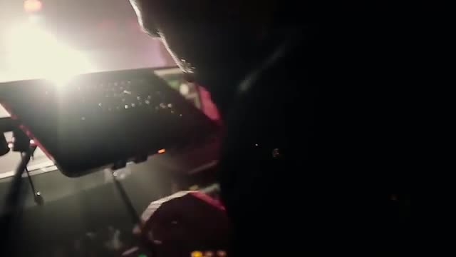 dj Plays at the Disco, Dancing People in the Background