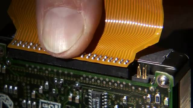 Internal computer parts being connected.