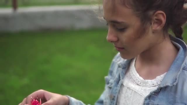 Girl Receiving Red Flower As Love Gift