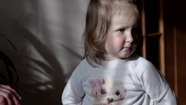 Little Girl Plays With a Cookie Didn't Want to Share