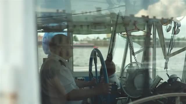 Ship Captain Steering His Ship