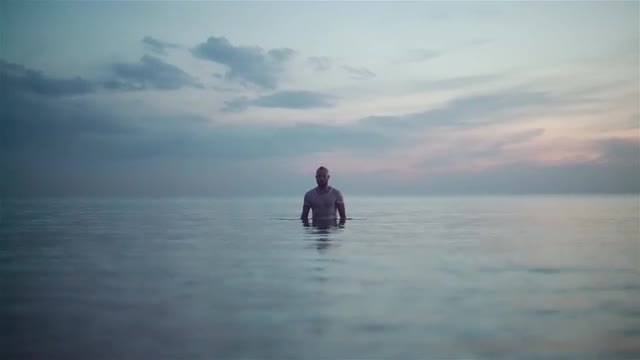 Young Man Emerging From Water