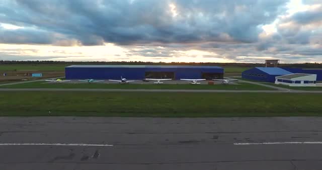 Small Airplanes Near Hangar