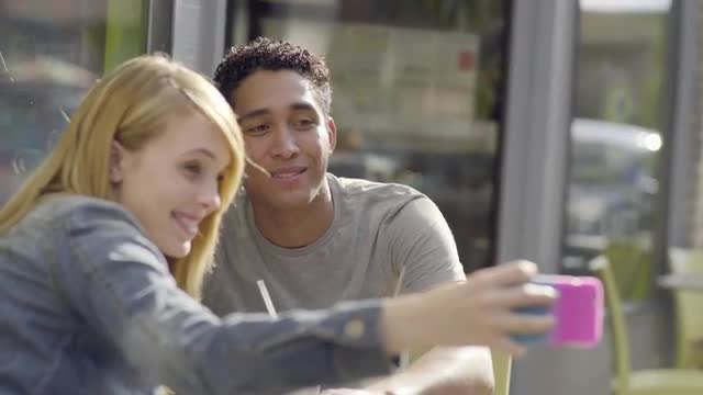 Young Woman Takes Photos Of Her Silly Boyfriend, They Cheers With Milk And Eat Cookies (4K)