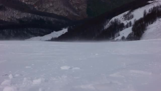 Mountain Peak With Snow Blow by Wind. Winter Landscape. Cold Day, With Snow Shining in the Sun.