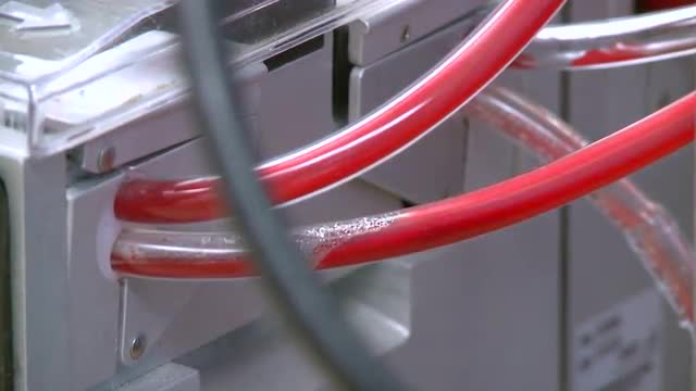 Tubes carry blood from a bypass machine (6 of 8)