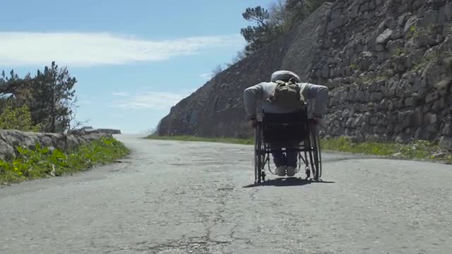Handicapped Man On Mountain Pathway