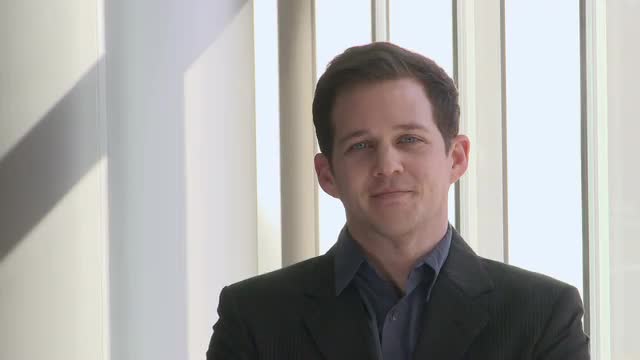 Smiling young male professional (mid 20's)