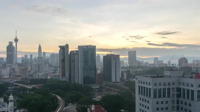 beautiful sunrise at Kuala Lumpur city from a rooftop of building