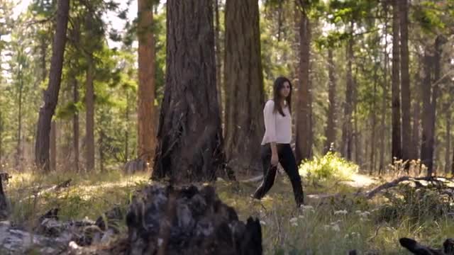 Girl Walking through Forest