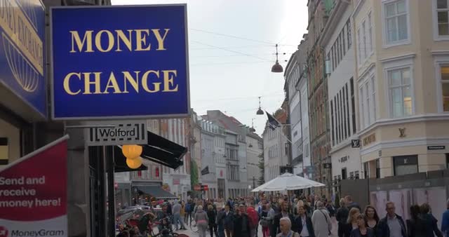 Money Change banner in crowded street