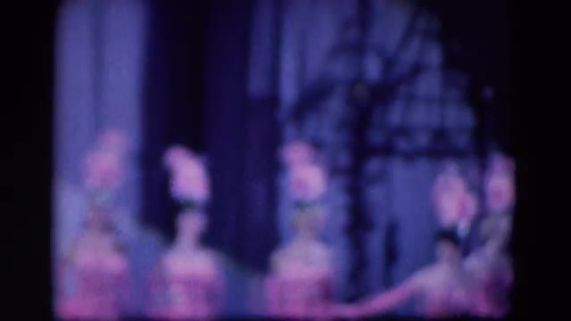 1969: a chorus of beautiful showgirls on stage in elaborate pink costumes FORT WAYNE, INDIANA