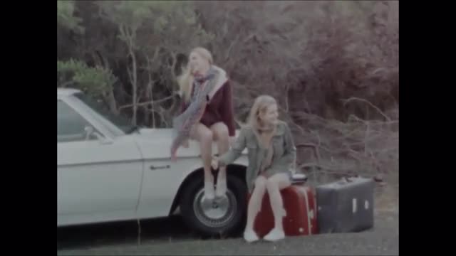 Young female twins wait...