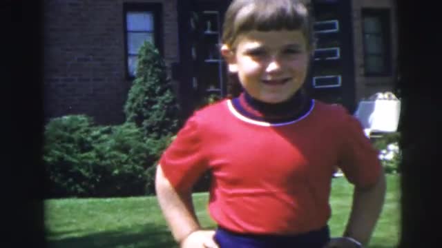 1955: pretty little girl showing off for the camera in front of her house PENNINGTON, NEW JERSEY 1955: pretty little girl showing off for the camera in front of her house PENNINGTON, NEW JERSEY