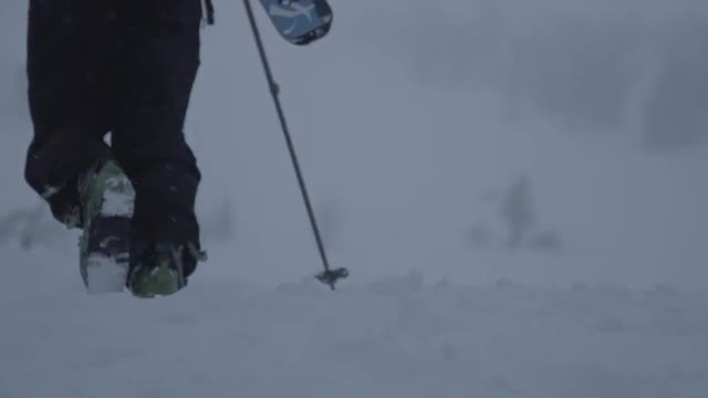 Skier Hiking on an Overcast Day (Slow Motion)