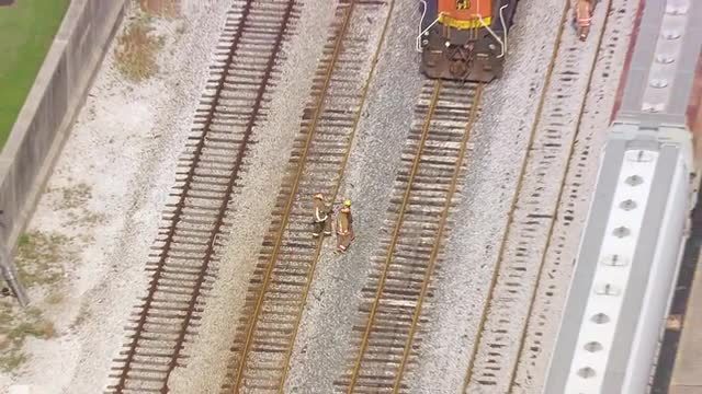 MS POV AERIAL TS ZO Firefighter walking towards dock fire along Mississippi river / United States