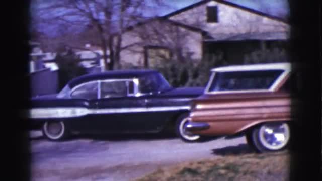 1961: one person in an old black car with white stripe backing up and pulling off. CLARKSDALE, ARIZO