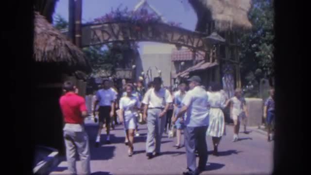 1962: dozens of people entering and exiting an amusement park DISNEYLAND, CALIFORNIA