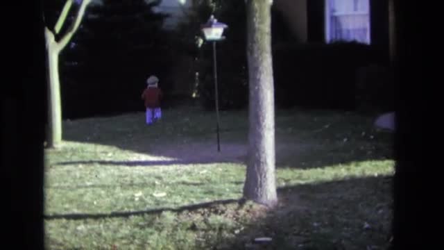 1975: kid going down driveway in hot wheels seated style car racer CALIFORNIA