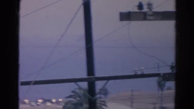 1966: a view of the coastline as seen through wires and telephone poles CALIFORNIA
