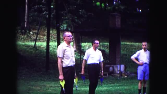 1971: a group of me outdoor playing lawn darts OMAHA, NEBRASKA