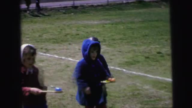 1964: children playing a game with easter eggs CAMDEN, NEW JERSEY