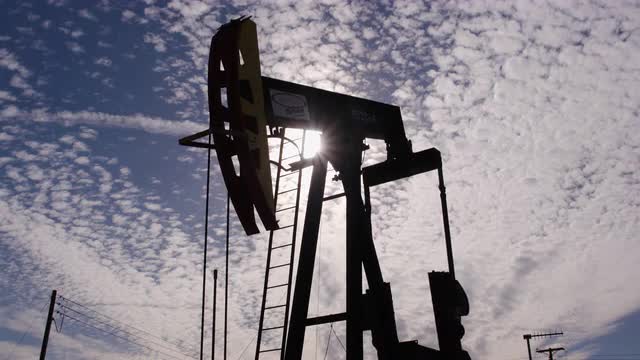 Oil Pump silhouette Low Angle back lit by the sun