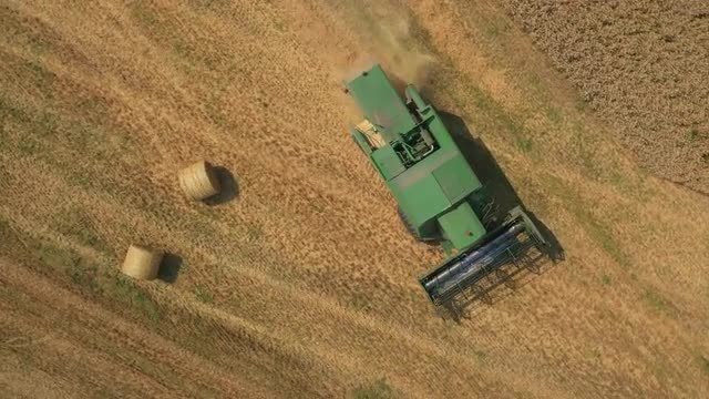 Aerial Drone footage of combine harvester, UK