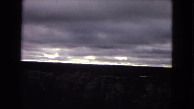 1967: overview of a natural canyon and mountains that border on a fairly cloudy day ARIZONA