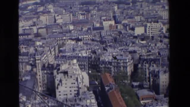 1969: aerial color shot of densely a populated city PARIS, FRANCE
