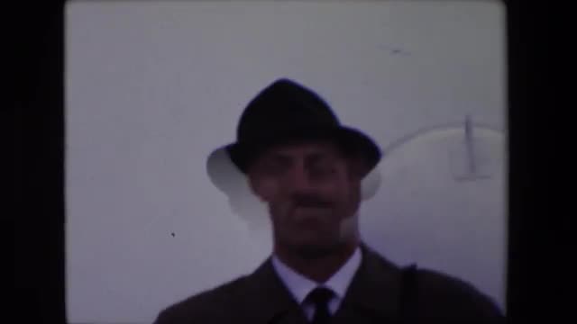 1967: man in suit shaky image hat wear CALAIS,FRANCE
