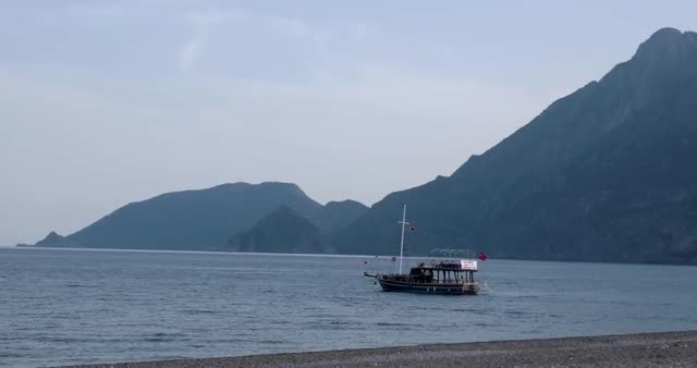 Ship Sails on the Blue Sea at Sunny Day on a Background of Mountains in the Adriatic Sea.