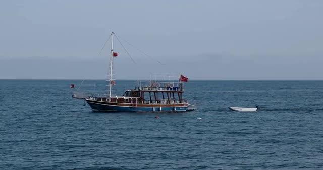 Ship Sails on the Blue Sea at Sunny Day on a Background of Mountains in the Adriatic Sea.
