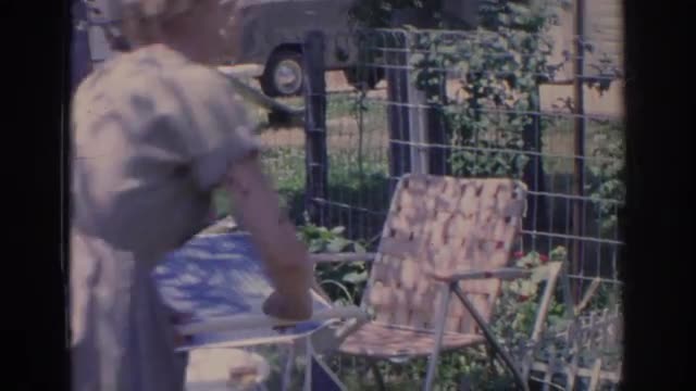1966: ladies cooling off in the shade beside a vegetable garden. FLORIDA