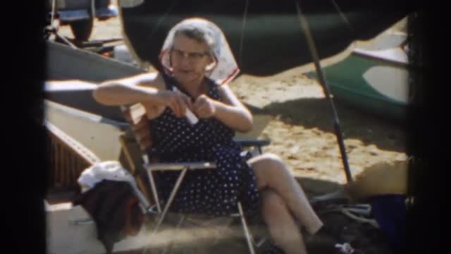 1963: woman sitting out by the lake. NEW JERSEY 1963: woman sitting out by the lake. NEW JERSEY