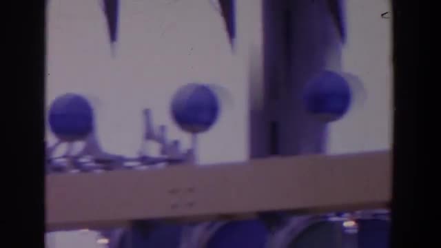 1964: people walking around at an amusement park. WORLD'S FAIR, NEW YORK CITY