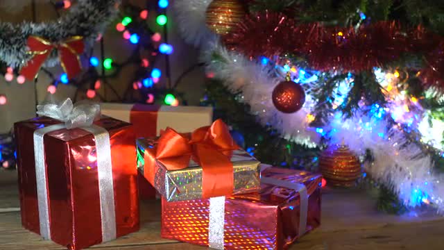 Christmas Gifts Under the Christmas Tree Lights Flashing Camera Movement