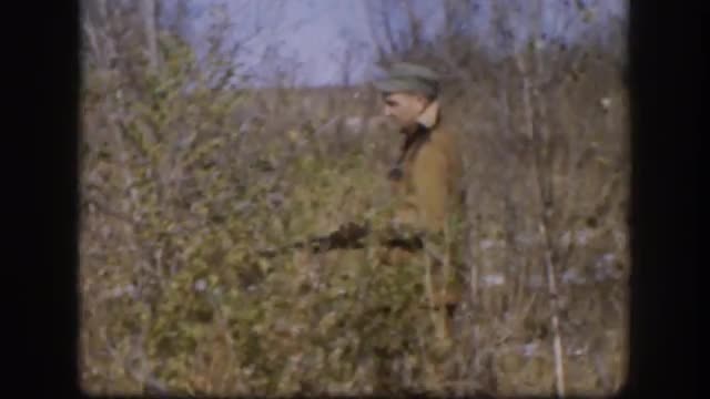 1958: a hunter walking through the bushes KANSAS