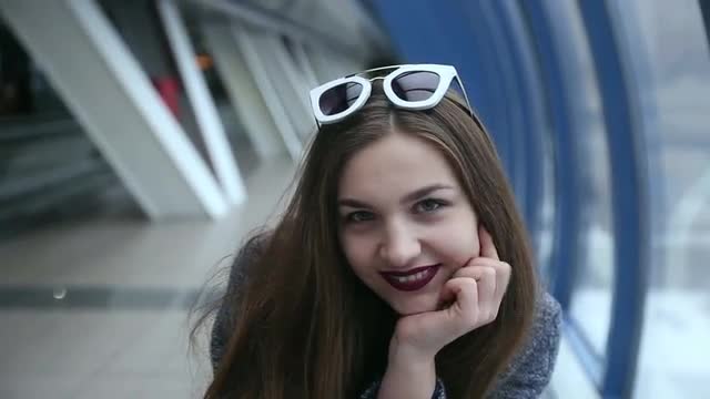 Girl with sunglasses playing and flirting