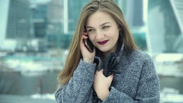 Girl talking on the phone on the street
