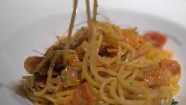 Close-up shot of eating pasta dish in restaurant