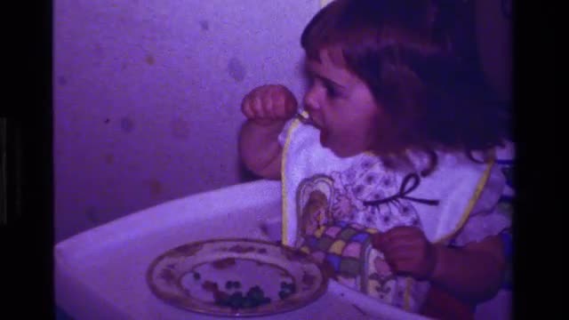 1979: family is enjoying the dinner party with some great food around. CALIFORNIA