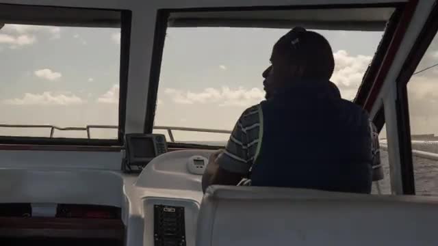 Timelapse of a captain steering a yacht